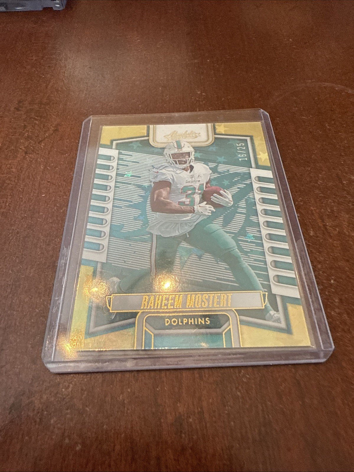 2023 Absolute Raheem Mostert /25 #40 Gold Foil Dolphins